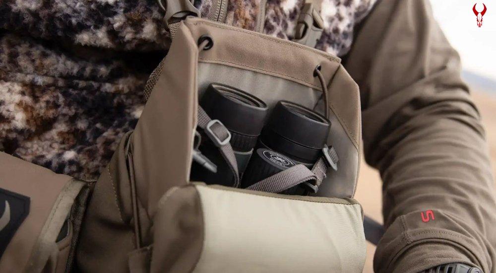 binoculars sitting in a binocular harness